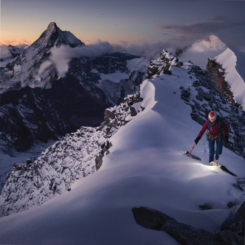 Photo of person snowshoeing on a mountain