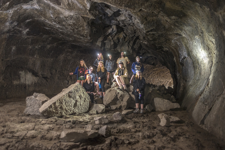Photo of students in a cave