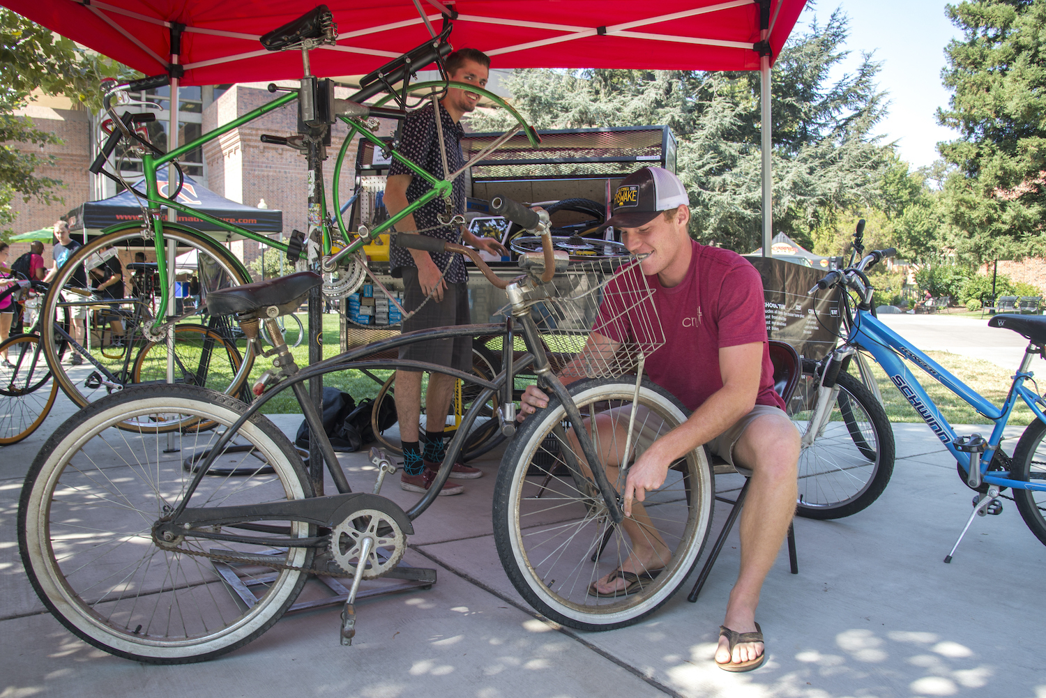 photo of student fixes bicycle