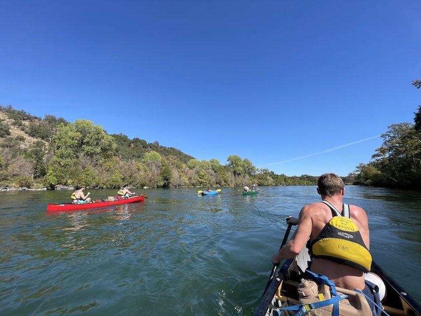 Photo of students canoeing on a river