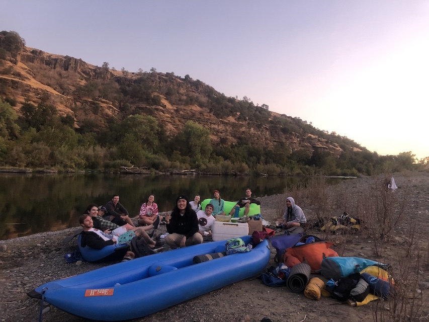 Photo of Students relaxing after a raft trip