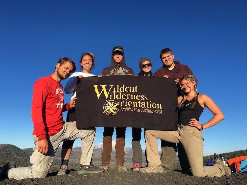 Photo of students holding WWO banner