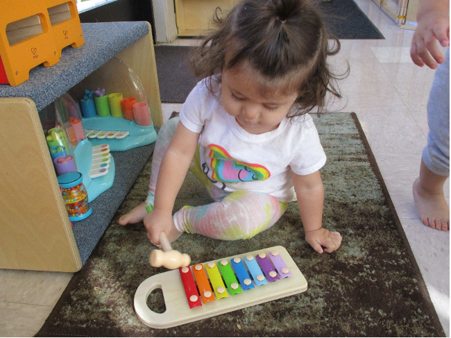 Photo of a child playing music