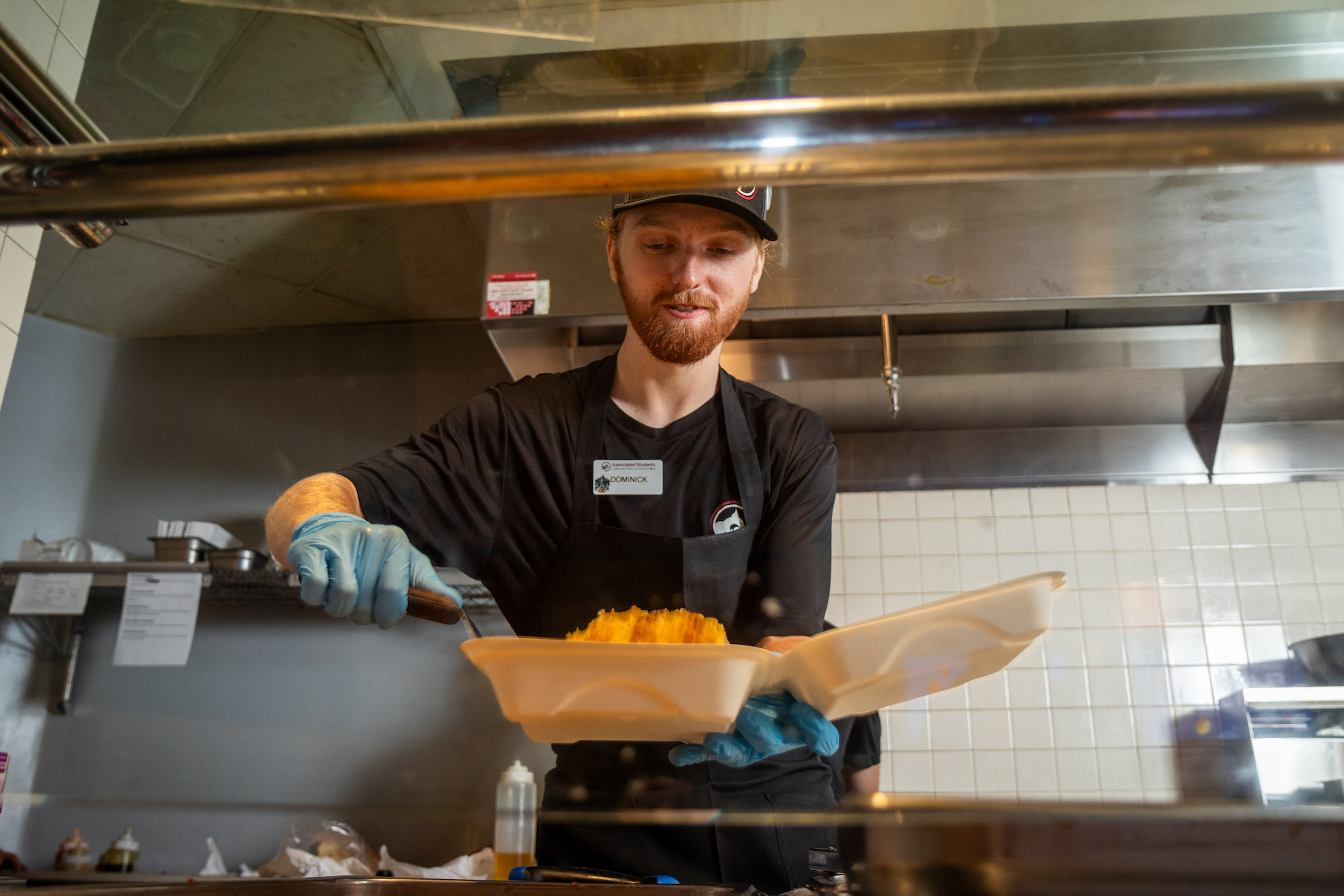 Photo of man scooping food