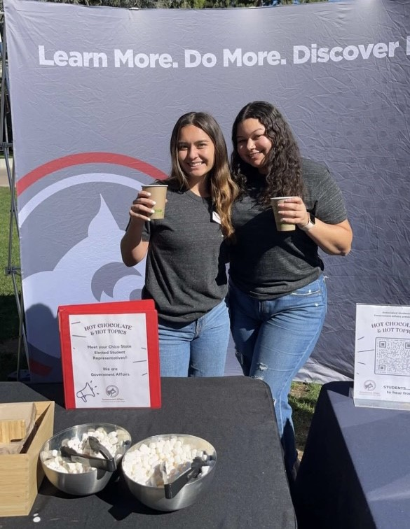 Photo of two women holding cups