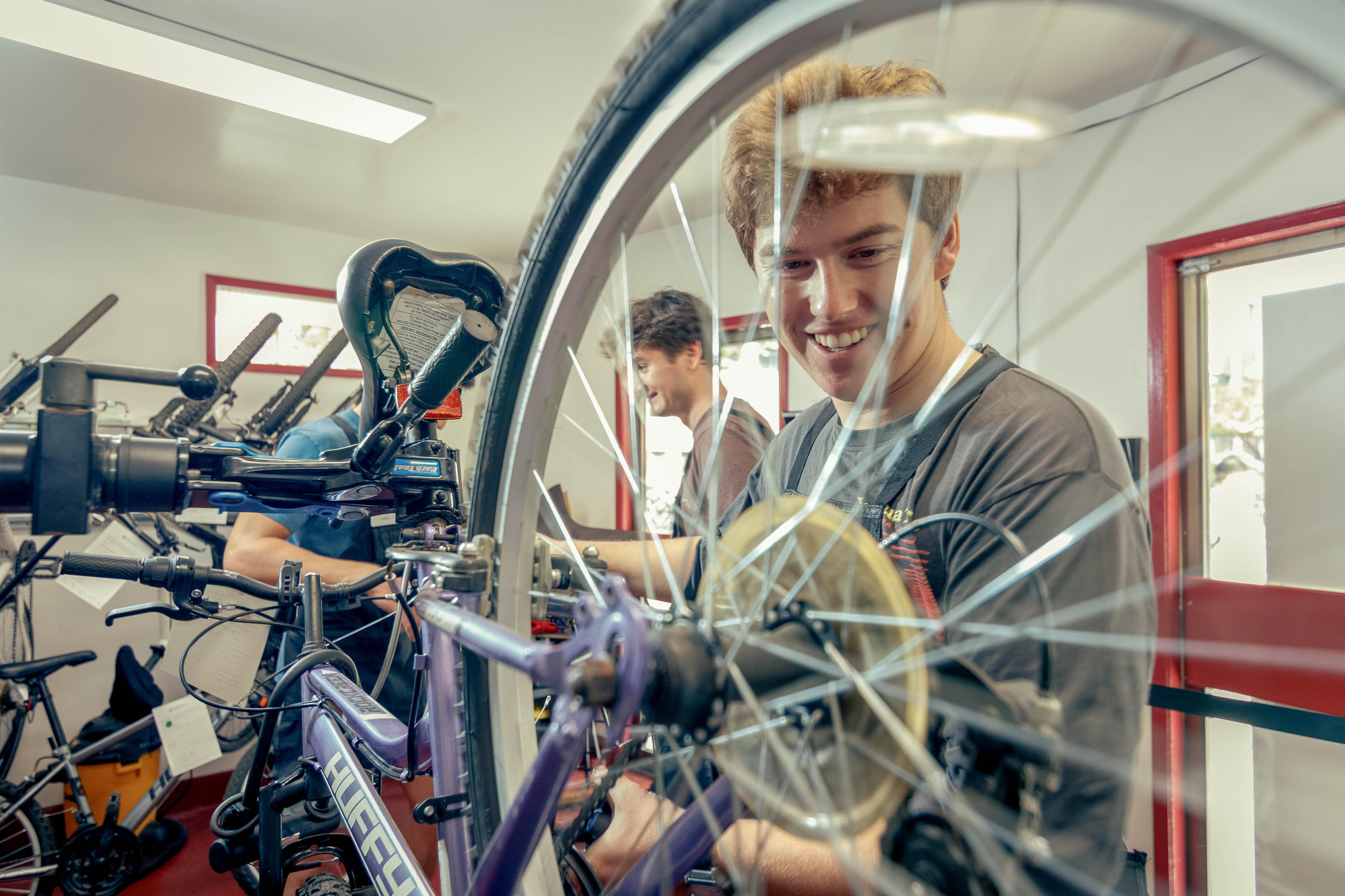 Student employees of the Bike Hub repair bikes in the Bike Hub's new location outside Holt Hall on Tuesday, Aug. 25, 2026 in Chico, Calif.  The Bike Hub, a program of Adventure Outings, offers low-cost bike maintainence, repairs, and upgrades to the campus community.
(Dash Ferrero/AS Photographer/Associated Students of CSU, Chico)