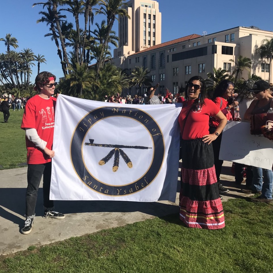 two people holding a flag