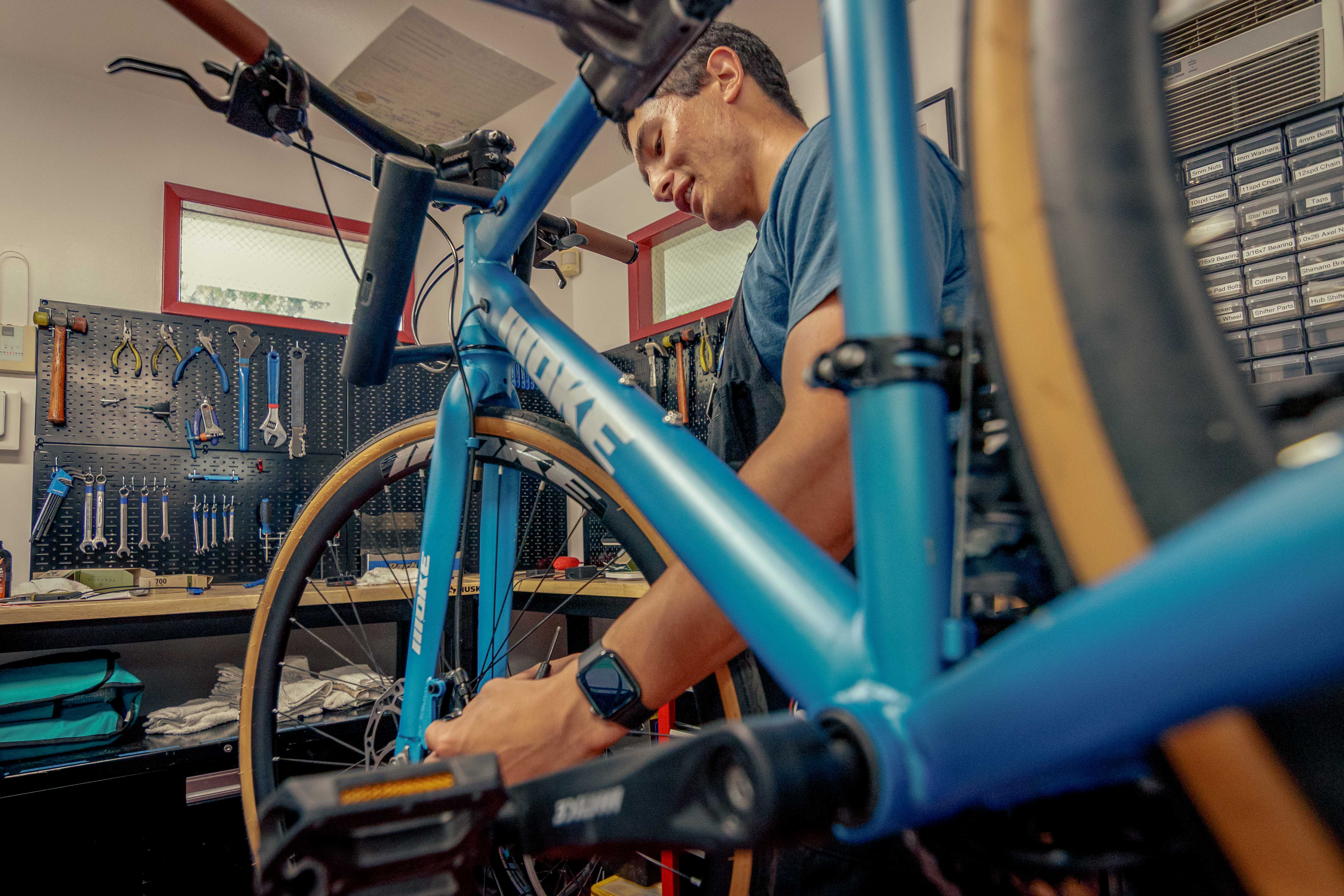 Student employees of the Bike Hub repair bikes in the Bike Hub's new location outside Holt Hall on Tuesday, Aug. 25, 2026 in Chico, Calif.  The Bike Hub, a program of Adventure Outings, offers low-cost bike maintainence, repairs, and upgrades to the campus community.
(Dash Ferrero/AS Photographer/Associated Students of CSU, Chico)