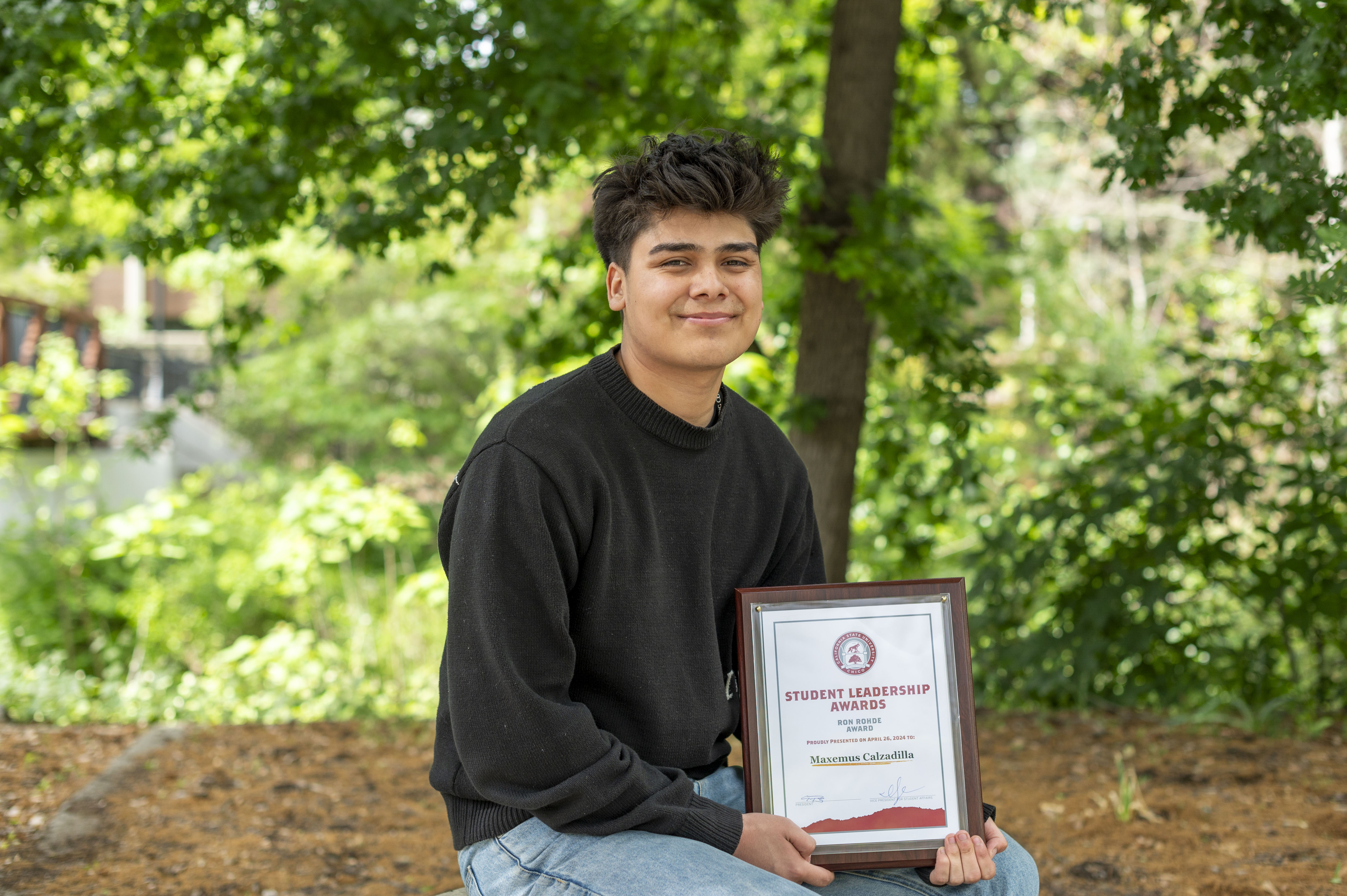 Maxemus Calzadilla poses for a photo with his Ron Rohde Award.