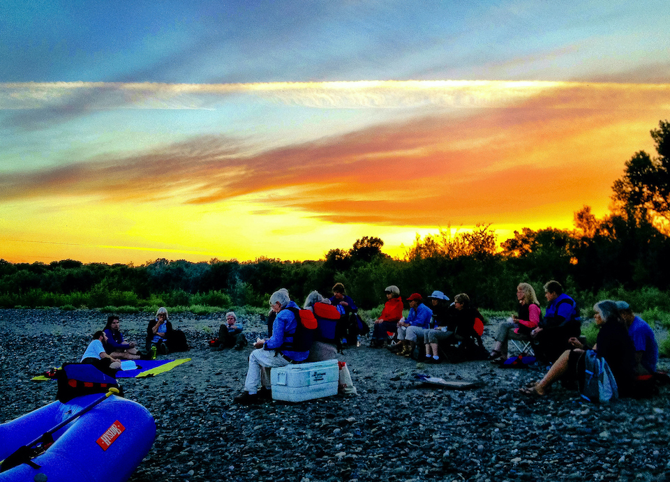 people sitting during sunset