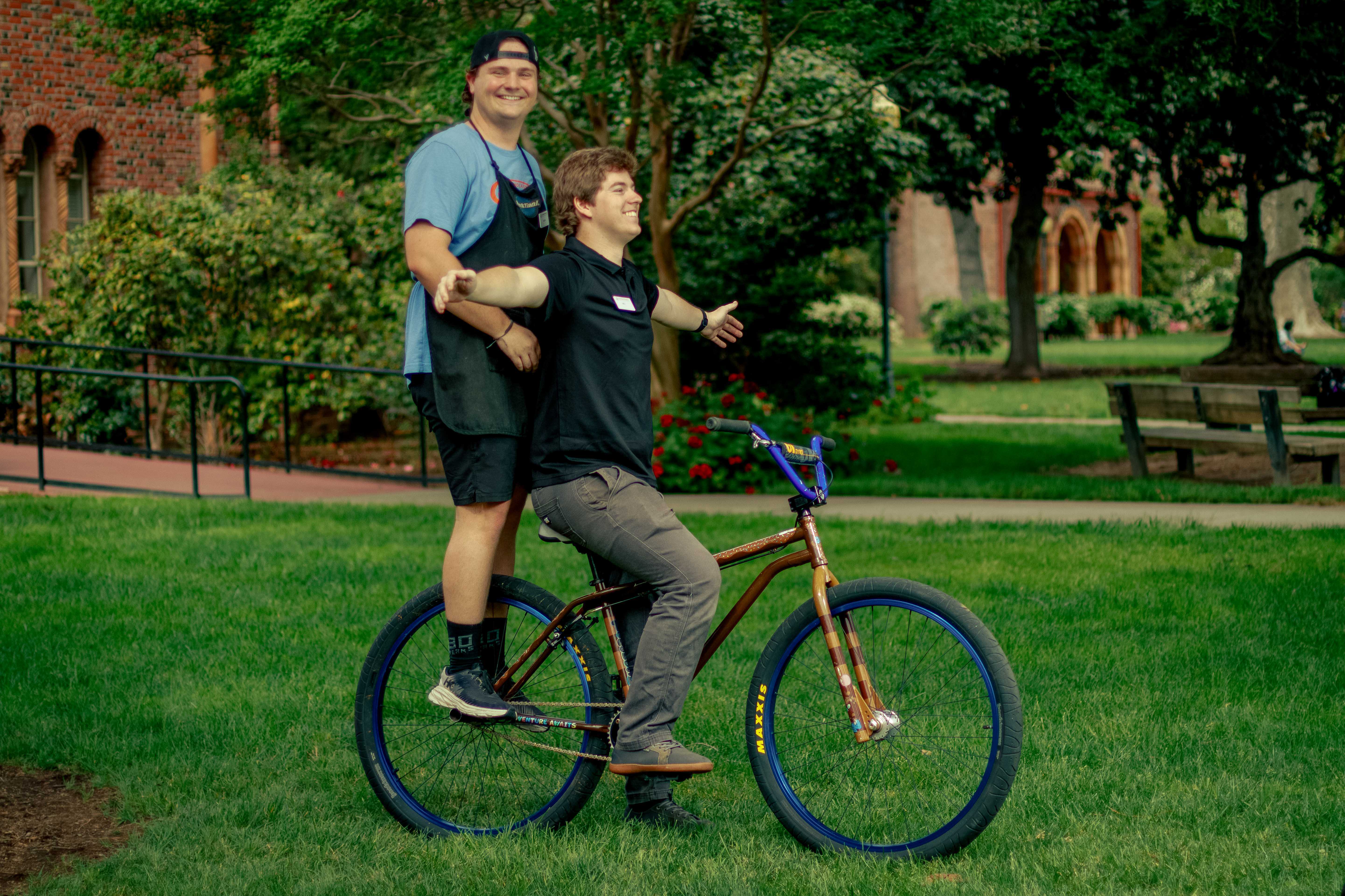 Bike Hub employees pose with a bicycle availible in the upcoming Bike Auction on Monday, Mar. 30, 2026 in Chico, Calif. 
(Dash Ferrero/AS Photographer/Associated Students of CSU, Chico)
